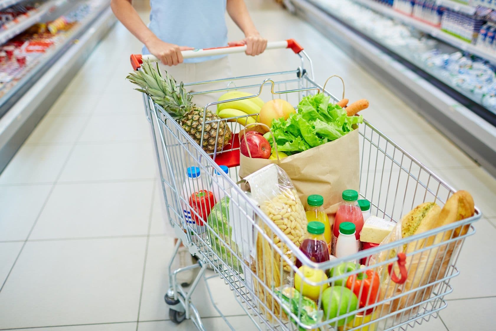 Unsecured business loan for wholesaler stores - Customer purchasing groceries