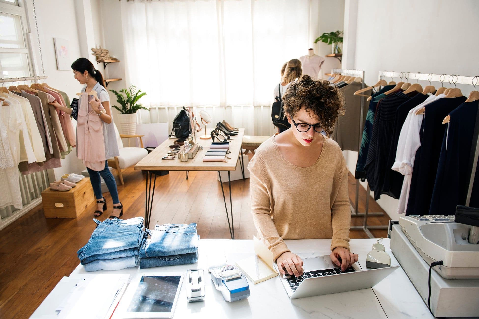 online retailer business loan - the female business owner is using a laptop for online business
