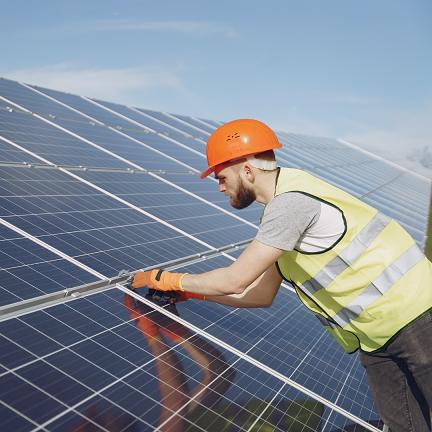 Solar business loan - Worker repairingthe solar panel