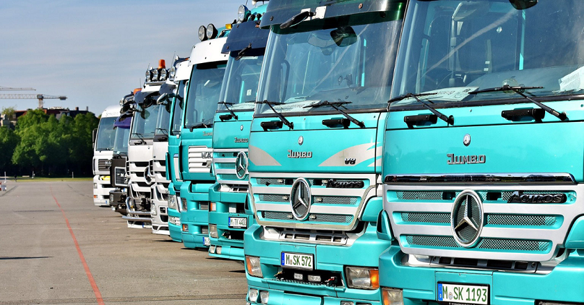 Transport business loan - A line of Trucks in the parking